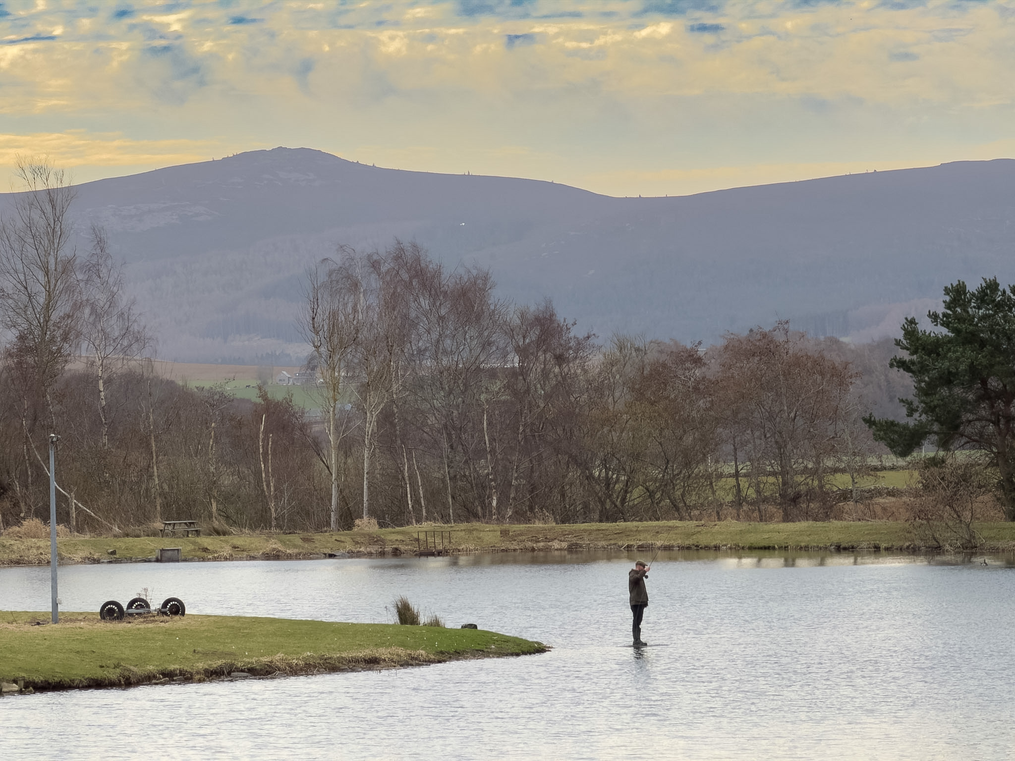 Four anglers fishing together at Loch Insch